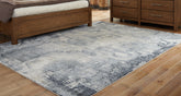 Bay Furniture Gallery - Ashley Furniture - Langrich Rug - 7'10" x 10'6" Rug / Blue/Gray/Cream - R406131